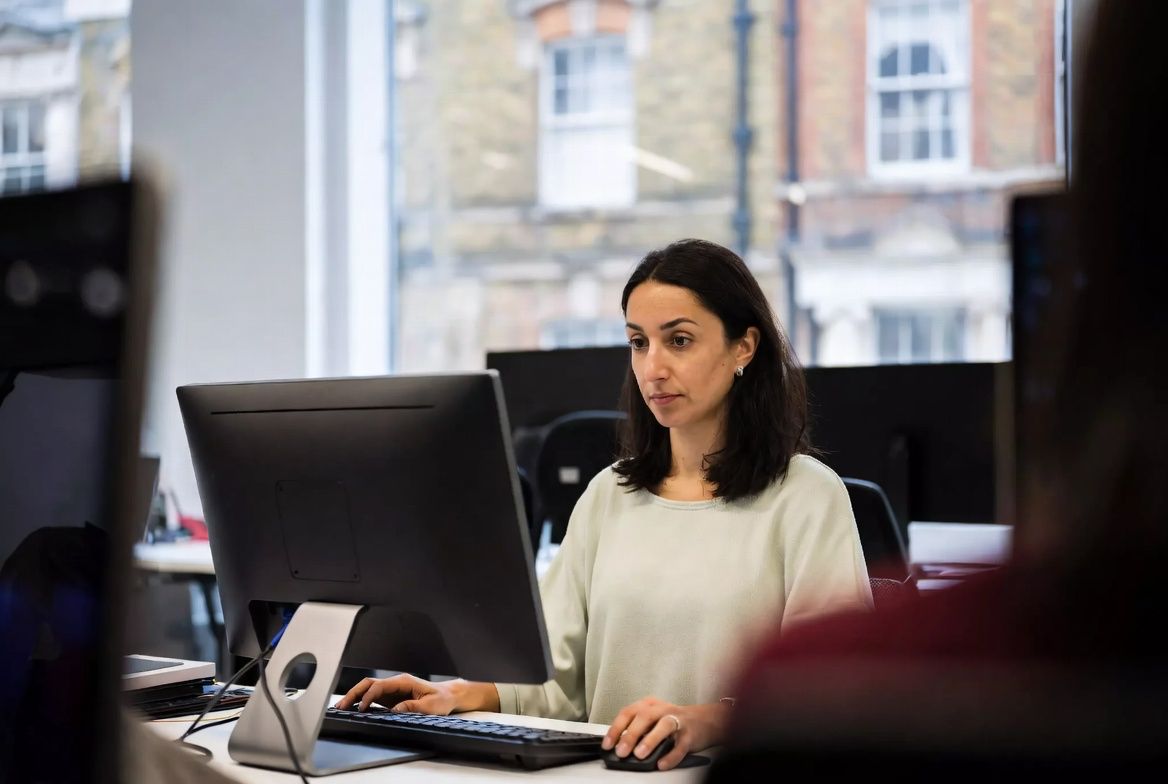 A member of the Swift team at her desk in the office