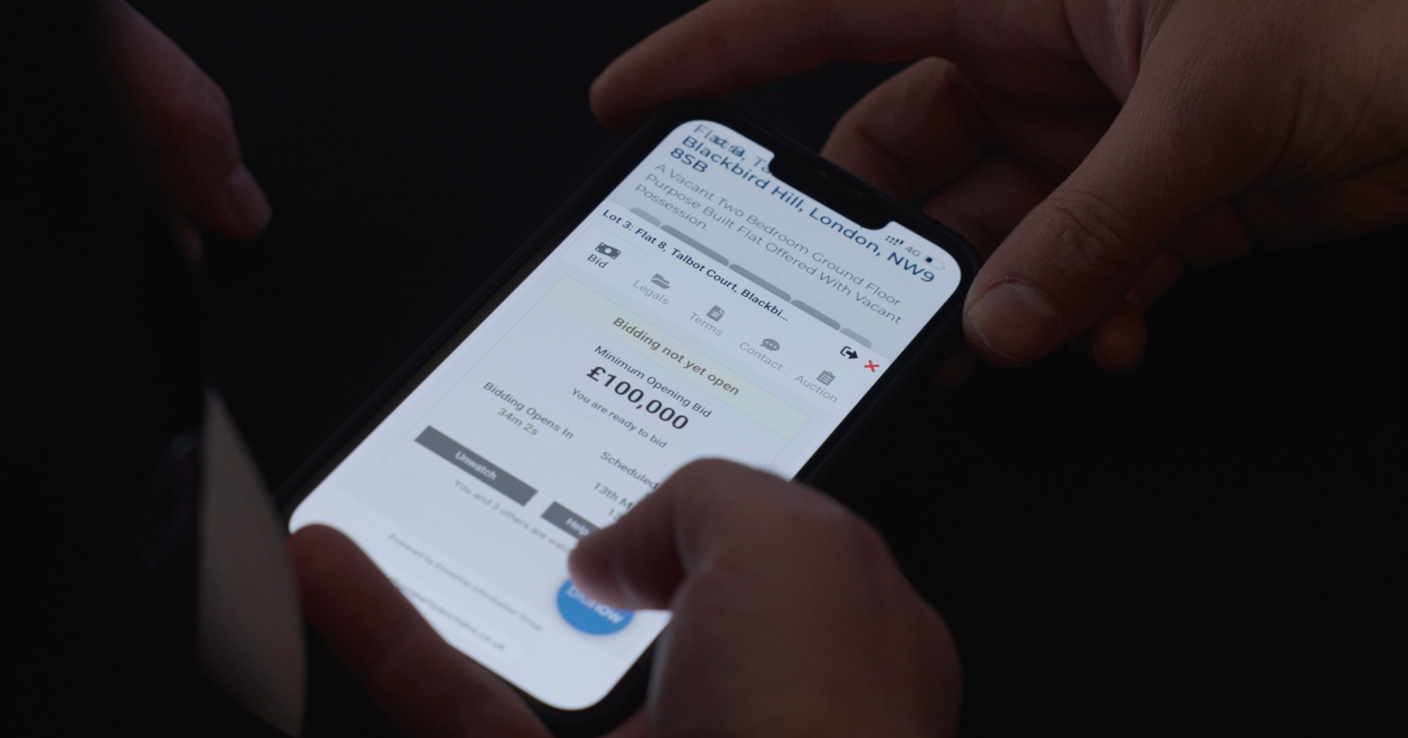 A buyer reviewing a Swift auction lot on a mobile phone
